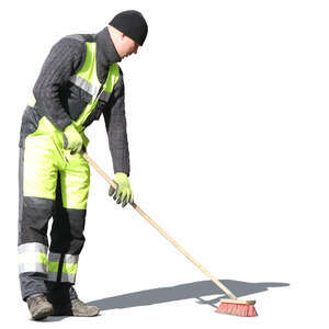 man with street brush doing spring cleaning