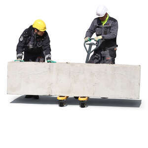 two workers lifting a large concrete block