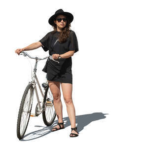 cut out woman in a black dress and black hat standing with a bicycle