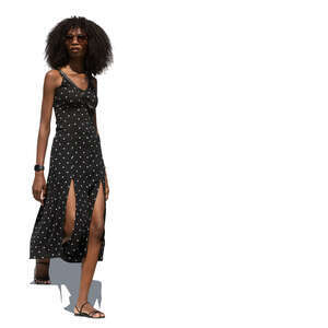 cut out woman in a polka dot dress walking down the stairs