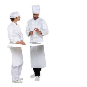 two cut out chefs talking behind a kitchen counter
