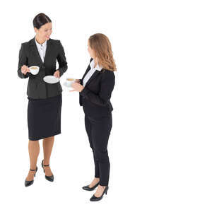 two cut out businesswomen drinking coffee seen from above