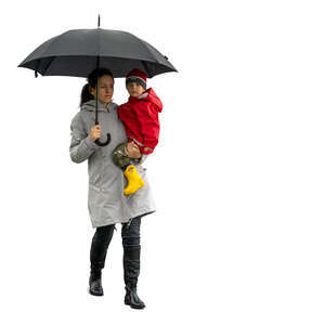 cut out woman and little boy walking in the rain with umbrella
