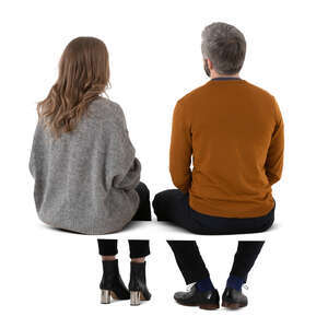 cut out man and woman sitting together seen from back angle