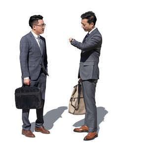 two cut out asian businessmen standing and talking