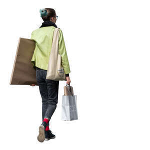 cut out woman carrying a large package under her arm walking