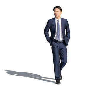 cut out asian man in a dark suit walking