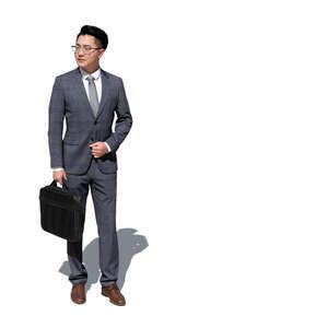 cut out asian man in a suit standing outside