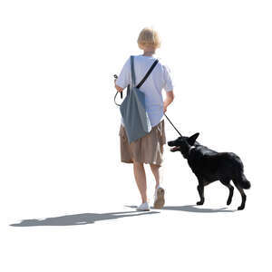 cut out backlit woman walking a dog