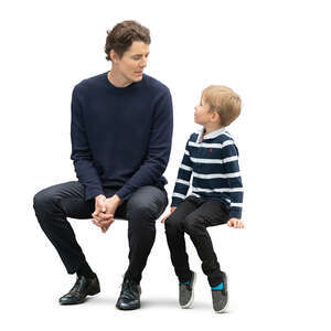 cut out father and son sitting and talking