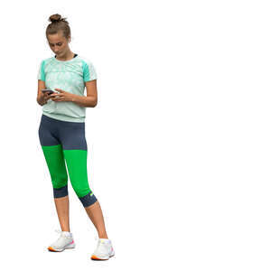 cut out woman in sports clothes standing and looking at a phone