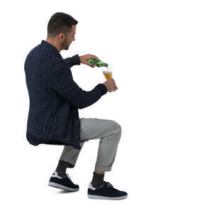 cut out man sitting and drinking beer