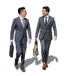 two cut out chinese businessmen walking