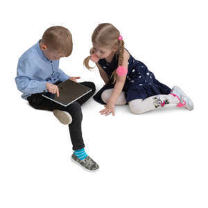 two cut out kids sitting and playing with a tablet