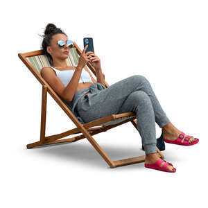 cut out woman lying in a garden chair and texting