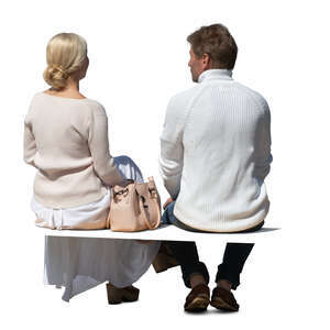 two cut out middle aged people sitting