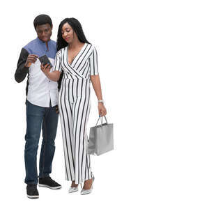 two cut out black people standing and looking at a phone