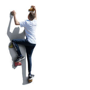 cut out boy climbing on an outdoor climbing wall