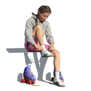 cut out woman sitting and taking off roller skating shoes