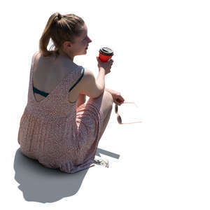 cut out backlit woman sitting and drinking coffee