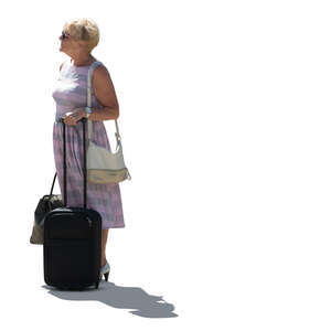 cut out older backlit woman with a suitcase standing