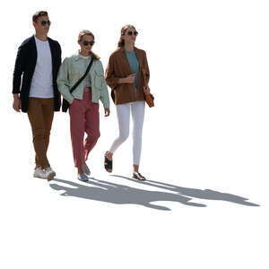 cut out backlit group of three people walking