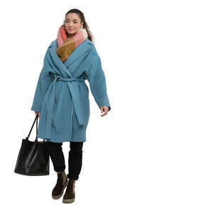 cut out woman in a blue overcoat walking