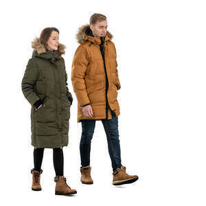 two cut out people in winter jackets walking
