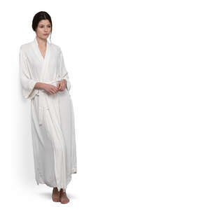 cut out woman in a long bathrobe leaning against the wall