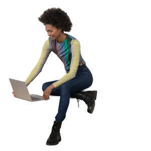 cut out black woman with a laptop sitting and working