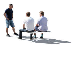 three cut out backlit men sitting and talking