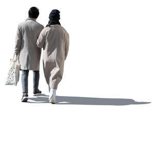 cut out sidelit couple in light spring coats walking