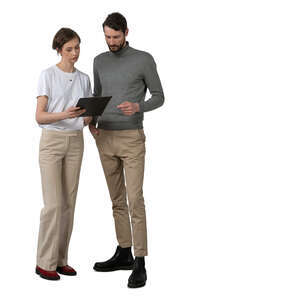 two cut out people standing and reading some papers