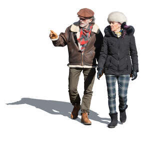 two cut out elderly people walking in wintertime