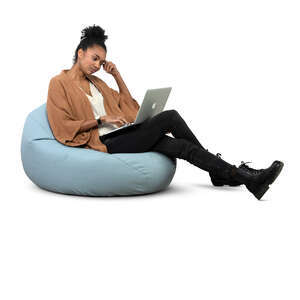 cut out woman sitting on a bean bag and working with laptop