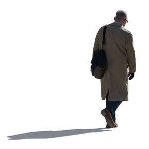 cut out older backlit man in a trenchcoat walking