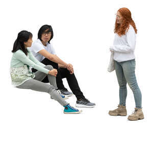 cut out woman standing and talking to two friends sitting on the stairs