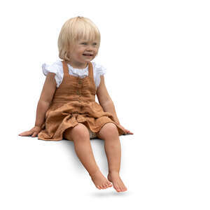 cut out little girl sitting barefoot and smiling