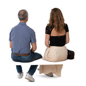 two cut out people sitting seen from back angle