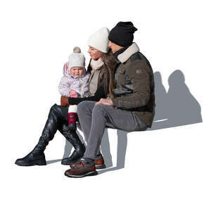 cut out family in winter sitting outside