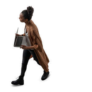 cut out woman with a laptop walking seen from above