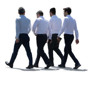 cut out group of backlit businessmen walking