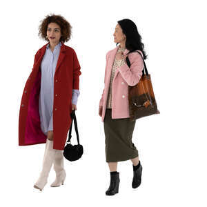 two cut out women wearing overcoats walking