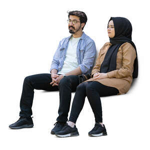 cut out middle eastern man and woman sitting