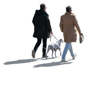 two cut out backlit men and a dog walking