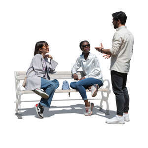 cut out man standing and talking to two women sitting