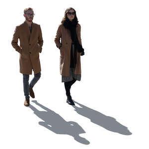 cut out backlit man and woman walking