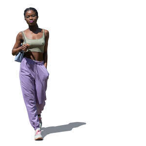 cut out young black woman walking on a summer day