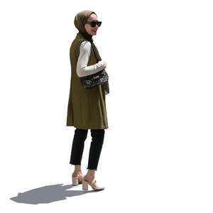 cut out backlit modern muslim woman standing