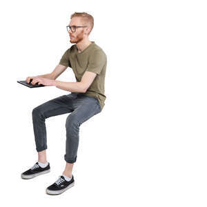 cut out man sitting and working with computer